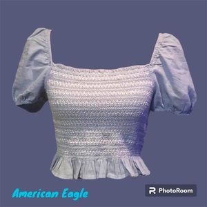 137: American Eagle cropped top. Sz m. Light blue. Smocked. Gently used.